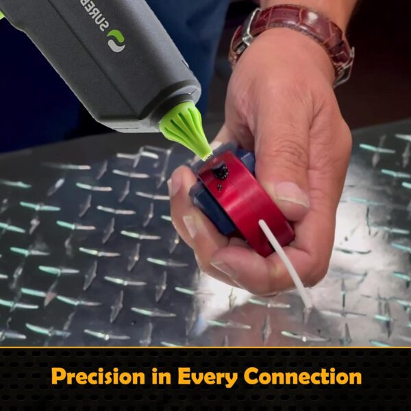 Close-up of hands using the SpliSeal mold and glue gun to seal a waterproof wire splice connection