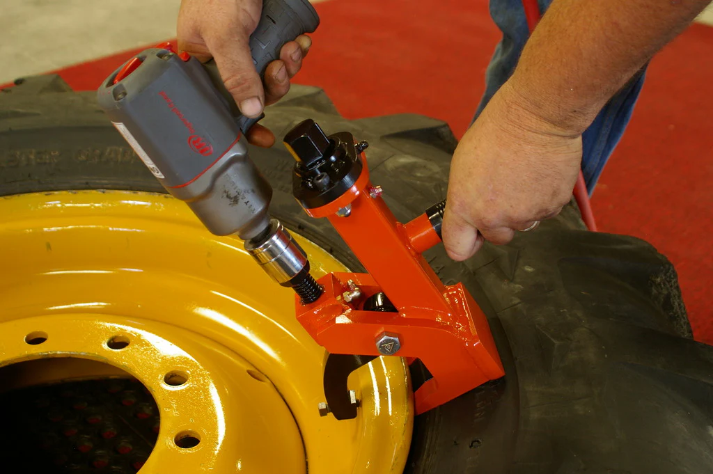 Pneu-Tek Bead Breaker in action removing tire bead from rim using impact wrench