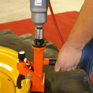 Using the Pneu-Tek Bead Breaker to separate tire bead from rim during tire service