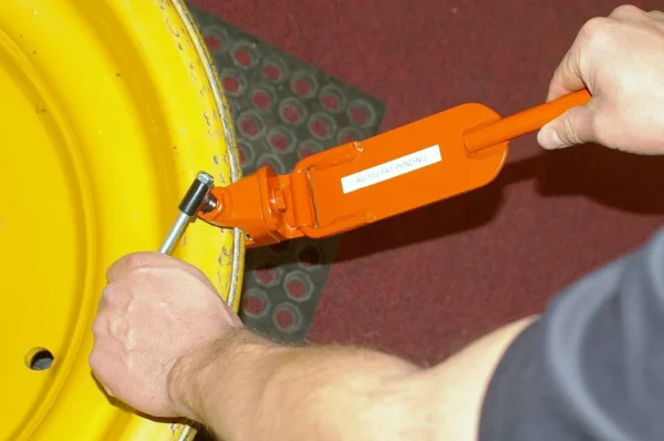 Pneu-Tek AG103 bead keeper with flip-handle design for large agricultural tire mounting